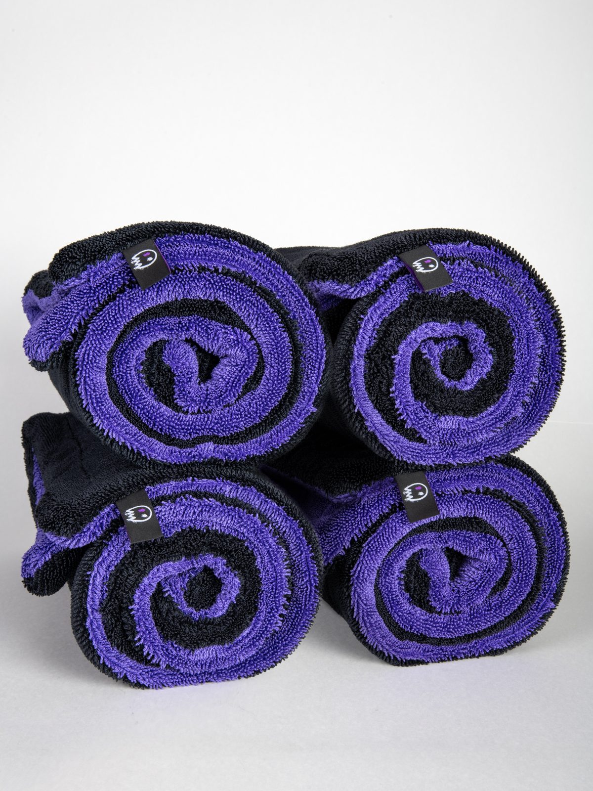 Four rolled Phantom drying towels
